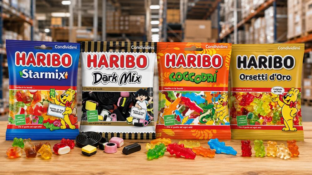 Quattro referenze Haribo — Starmix, Dark Mix, Coccodrì, Orsetti d'Oro — esposte su bancone nel magazzino Secolo